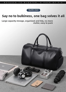 Black travel bag with laptop and camera showing its large storage capacity