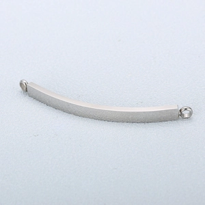 Close-up of polished stainless steel curved bar connectors for DIY jewelry making
