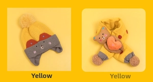 Detail of yellow knit hat and scarf set with cute 3D plush bear for toddlers