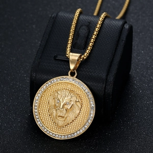 Gold plated stainless steel lion head pendant necklace with rhinestones on display