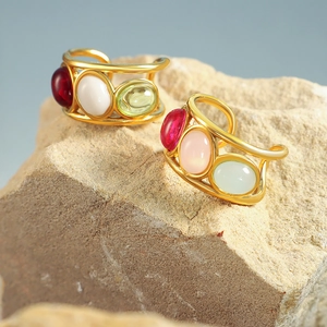 Vintage gold plated rings with colorful oval cabochon gemstones and wire wrap design