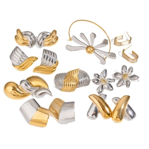 Two-tone mixed metal earrings and brooch set in irregular gold and silver polished designs