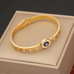 Gold evil eye bracelet with sparkling crystals on a jewelry box for a luxury look