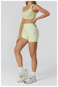Macro view of high-waist fitness shorts featuring ergonomic curved stitching and fabric