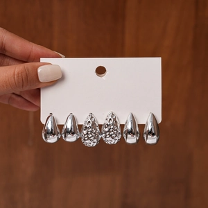 Detail of six-piece teardrop earring set featuring hammered and polished silver finishes
