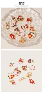 Detailed view of colorful Christmas enamel pendants featuring Santa and reindeer designs