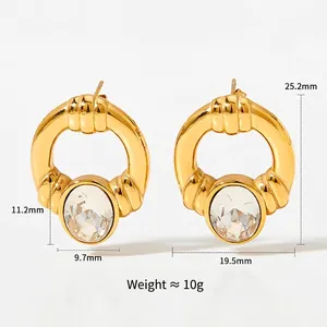 Boucles d'oreilles créoles dorées avec pierre ovale transparente et dimensions 25,2x19,5mm