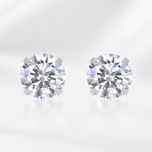 Detailed view of sterling silver moissanite stud earrings with classic four-prong setting