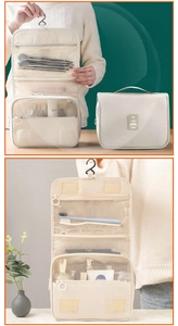 Macro view of beige hanging toiletry bag with zipper mesh compartments and top hook