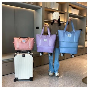 Universal wheels on expandable travel bags in pink, purple, and blue colors