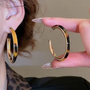 Vintage tortoiseshell acetate C-shaped hoop earrings with gold metal lining for women