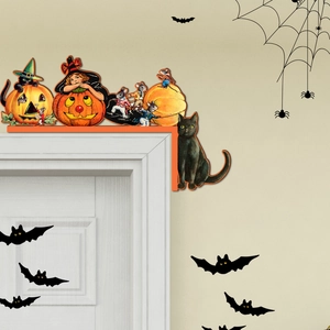 Detail of vintage Halloween wooden door corner decor with black cat and pumpkin motifs