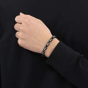 Mens stainless steel Byzantine skull bracelet with black and silver link chain detail