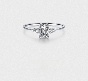 Macro view of S925 silver ring featuring radiant cut stone and elegant side diamonds