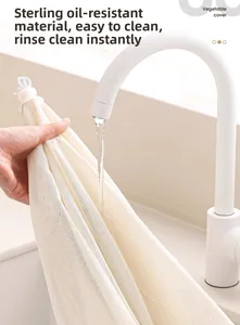 Detail of oil-proof mesh food cover being rinsed with water for easy cleaning