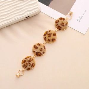 Detail of leopard print plush charms with gold magnetic clasp for DIY accessories