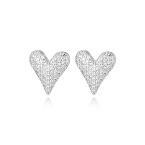 Macro shot of sparkling heart stud earrings with silver plating and pavé cubic zirconia