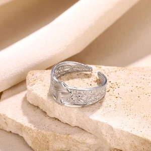 Detail of silver adjustable open ring with intricate mushroom and floral carvings