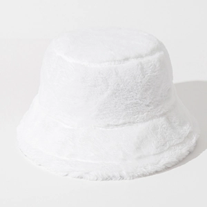 Close-up of white plush bucket hat with soft faux fur texture for winter warmth