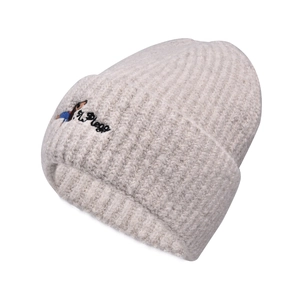 Detailed view of the ribbed knit beanie featuring a cartoon puppy embroidery detail