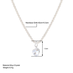 Detailed view of heart pendant necklace with dimensions 42cm length and crystal accents