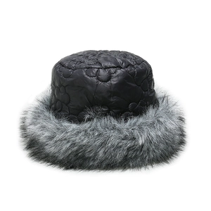 Close-up of quilted floral pattern and grey faux fur trim on a winter bucket hat