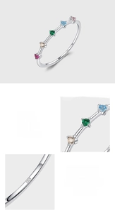 Macro detail of S925 sterling silver ring showing colorful cubic zirconia and hallmark