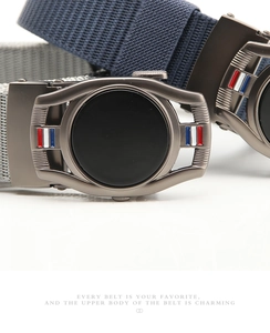 Macro view of navy and grey canvas belts with metal automatic buckles and enamel details