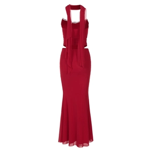 Detail of red backless mesh maxi dress featuring refined ribbons and a slim fishtail hem