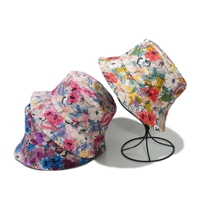 Women's reversible sun hat with colorful floral patterns for beach travel and vacations