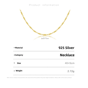 Macro detail of S925 sterling silver box chain with 3mm by 1mm gold cylindrical links
