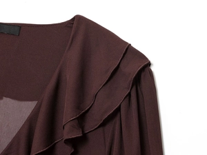 Detailed view of layered ruffles and V-neckline on a dark brown long-sleeve dress