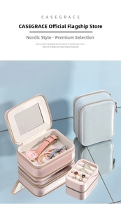Macro shot of compact travel jewelry box with mirror, zipper and plush compartments