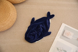 Close-up detail of a dark blue plush whale shell for DIY stuffed animal making