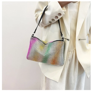 Detailed macro view of rainbow gradient rhinestone mesh shoulder bag with silver hardware