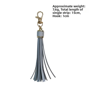 Light blue PU leather tassel pendant with gold metal clasp, length 15cm and weight 7.6g