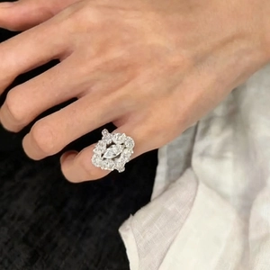 Luxurious silver ring with marquise zircon stones and radiant floral crystal design