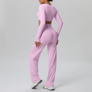 Detail of light pink long sleeve crop top and high-waist wide-leg yoga pants set