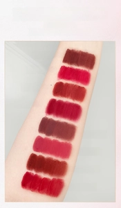 Arm color test of eight matte velvet lipstick shades from soft peach to deep red brown