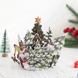 3D pop-up Christmas card featuring a winter snowy village and festive holiday 3D paper art