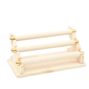 Three-tier velvet jewelry display stand with wooden base and gold metal caps for bracelets