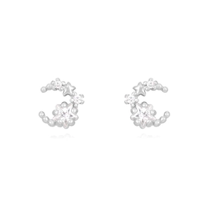 Detailed view of silver moon and star earrings with micro-inlaid zircon crystals