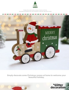 Close-up of wooden Christmas train featuring a hand-painted snowman and glitter details