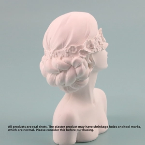 Detailed close-up of a resin plaster female bust jewelry display stand with a floral wreath