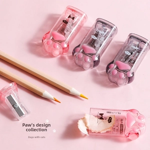 Detailed view of cat paw pencil sharpener showing inner blade and transparent pink shell