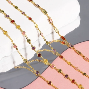 Close-up of 18K gold plated copper necklace with vibrant multi-colored cubic zirconia stones