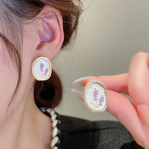 Vintage oval earrings with gold frame, white enamel and purple floral patterns