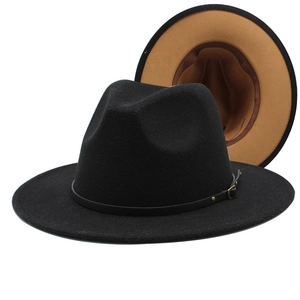 Detail of wool fedora hat with red-black contrast brim and faux leather belt