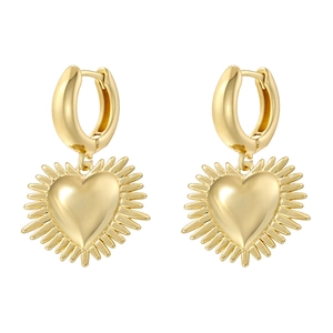 Detail of elegant gold heart earrings with radiant sunburst texture and polished finish