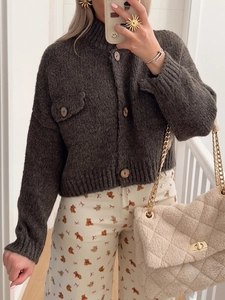 Women's dark grey knit button cardigan with front pockets and long sleeves for casual wear